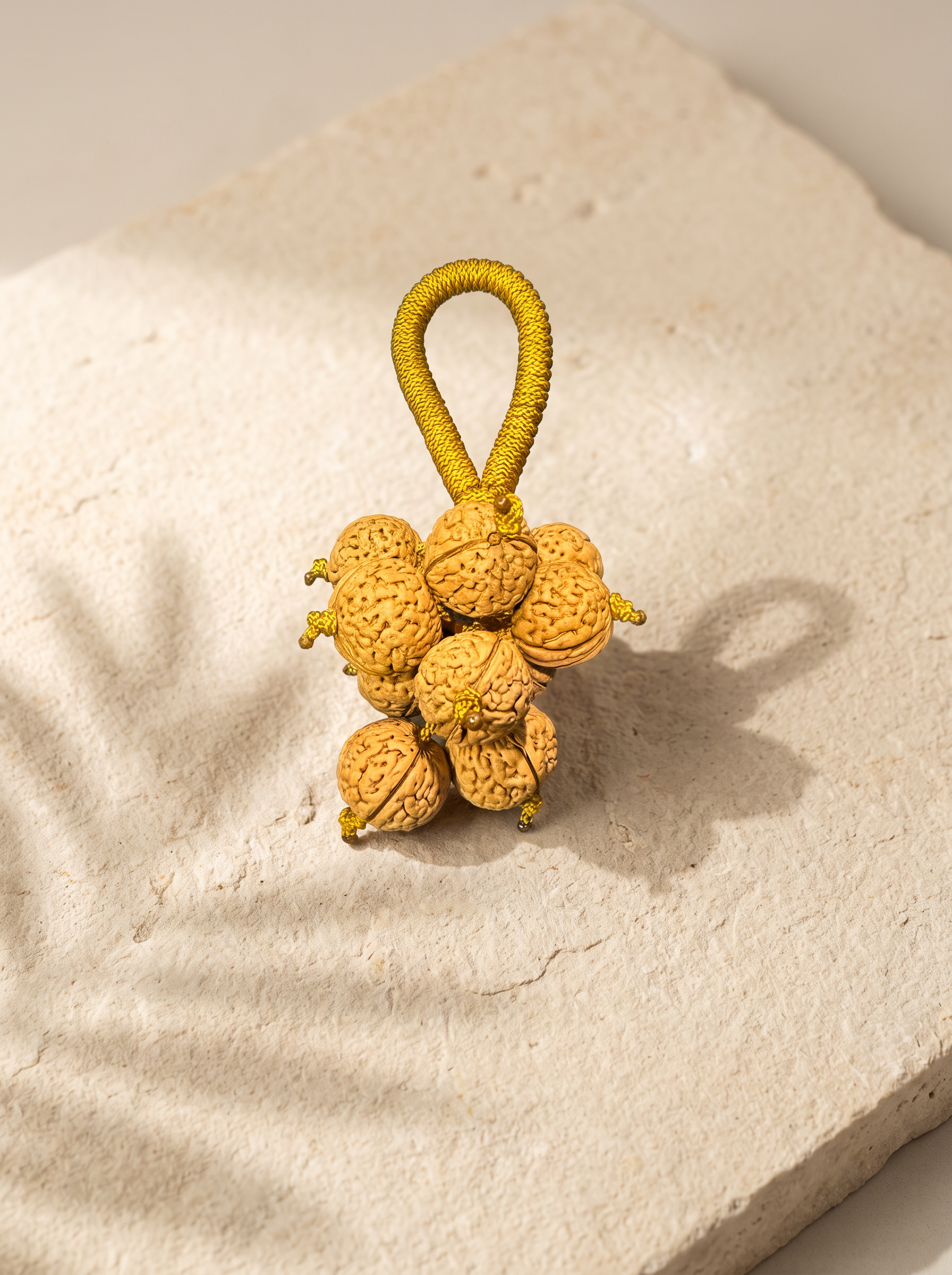 The real TRIONE Begin walnut ornament